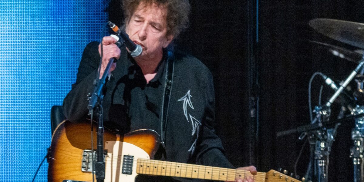 A Genius-Level Guitar Virtuoso Just Joined Bob Dylan’s Band. How Long Will This Last?