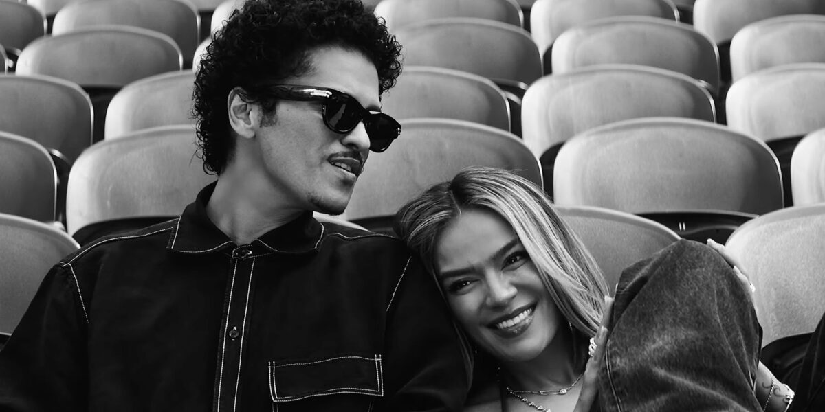 Karol G and Bruno Mars Fill a Stadium With Love in ‘Still’ Video