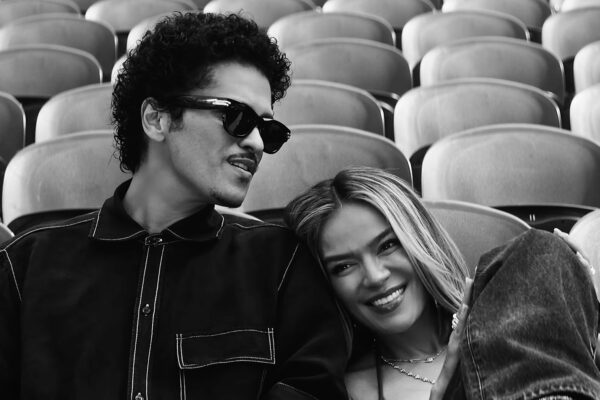Karol G and Bruno Mars Fill a Stadium With Love in ‘Still’ Video